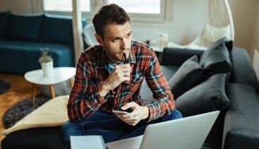 Person looking at computer making a decision