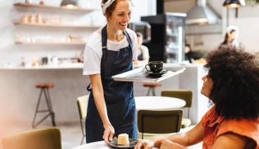 Business owner helping out a customer